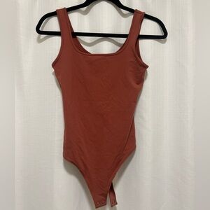 Pretty blush colored Abercrombie bodysuit